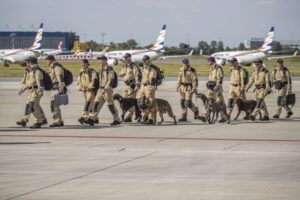 Czech Urban Search and Rescue (USAR) personnel about to board a plane at the Vaclav Havel Airport in Prague