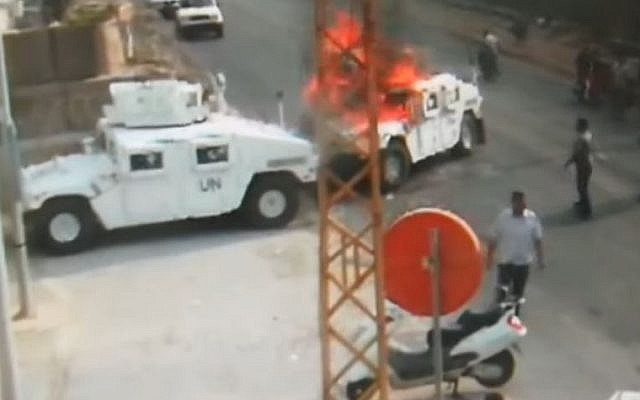 Hezbollah members set a United Nations peacekeepers' vehicle on fire in an incident in 2018 in southern Lebanon. the footage was first aired on August 28, 2019 (Screencapture/YouTube)