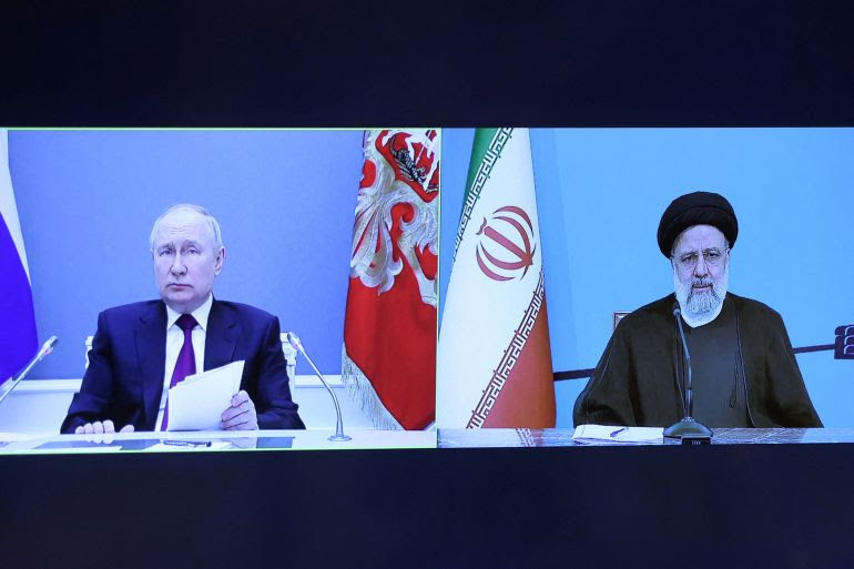 נשיא רוסיה ולדימיר פוטין ומקבילו האיראני אברהים ראיסי